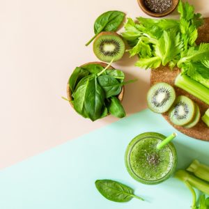 Healthy diet, alkaline, vegetarian concepts. Green smoothie with celery, kiwi and spinach.