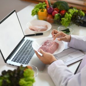 Professional expert in nutrition providing guidance to client online.